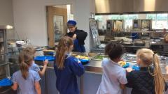 Children waiting in line for lunch at the canteen