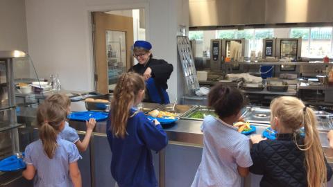 Children waiting in line for lunch at the canteen